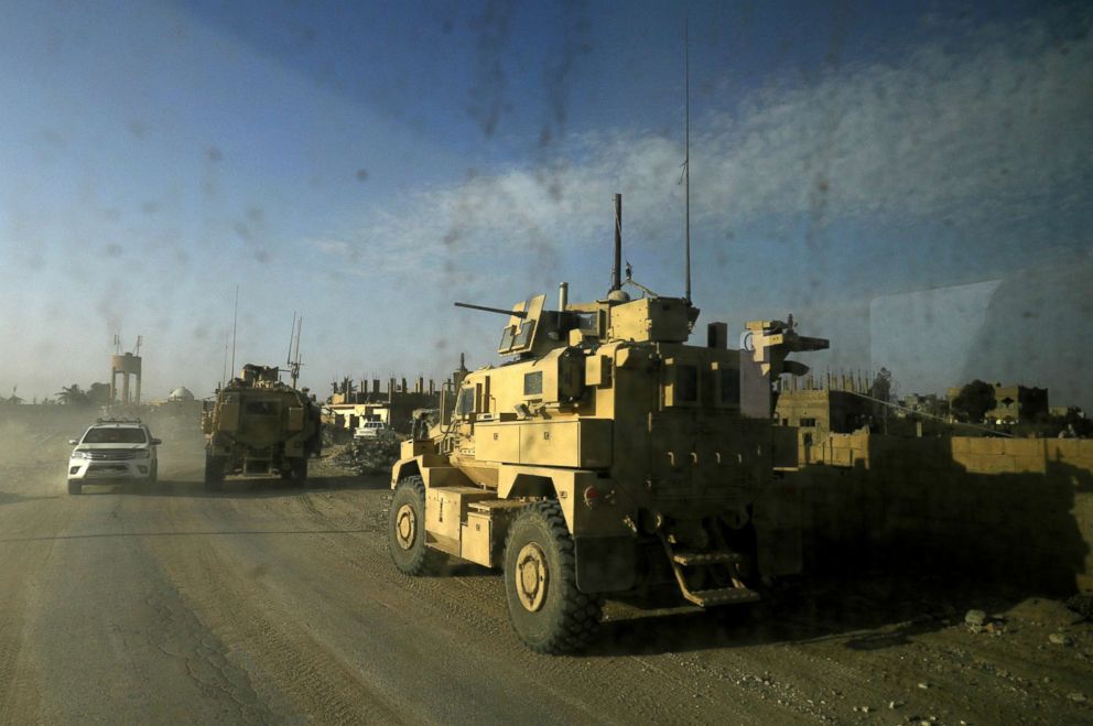 PHOTO: US military vehicles drive through the Baghuz, Syria, Jan. 26, 2019.