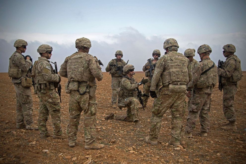 PHOTO: U.S. soldiers gather for a brief during a combined joint patrol rehearsal in Manbij, Syria, Nov. 7, 2018.