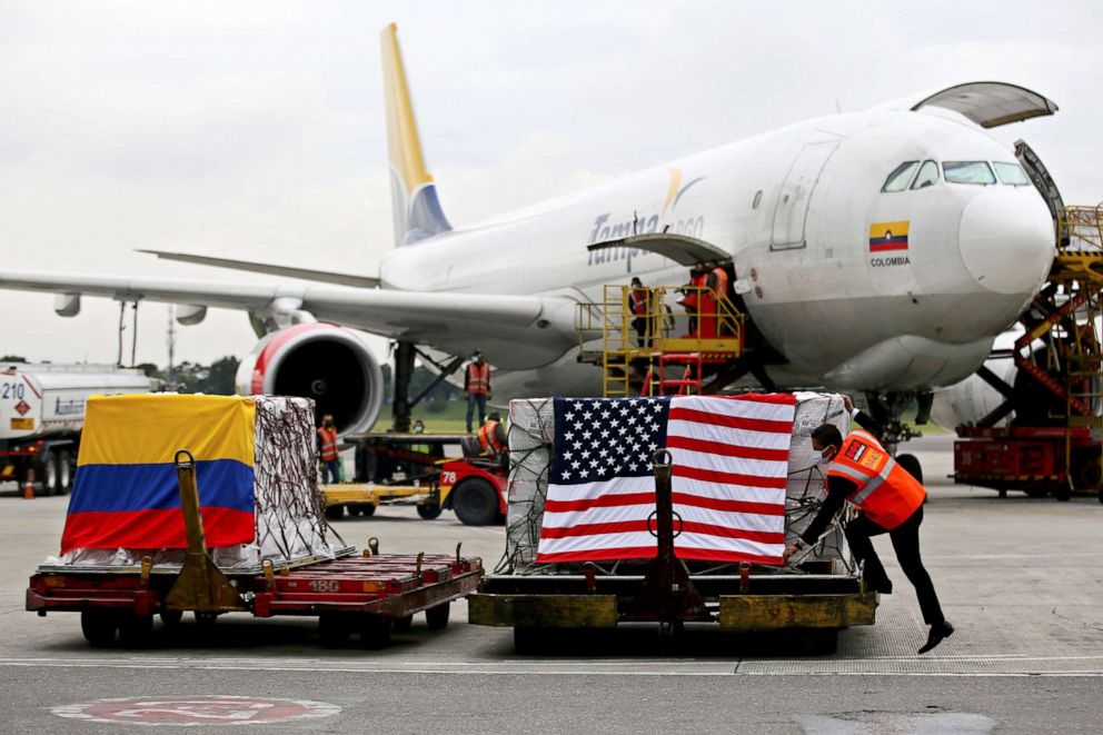 PHOTO: View of containers with some of the 3.5 million doses of Moderna COVID-19 vaccines donated by the US government, on their arrival at El Dorado International Airport, in Bogota on July 25, 2021.