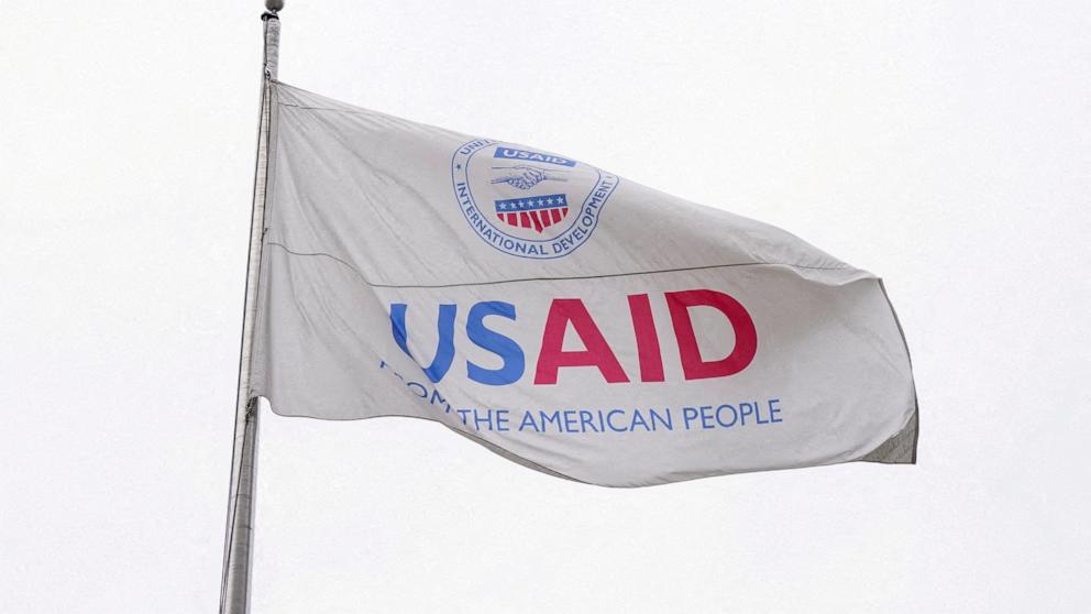 PHOTO: A USAID flag flutters outside, as the USAID building sits closed to employees after a memo was issued advising agency personnel to work remotely, in Washington, D.C., Feb. 3, 2025.