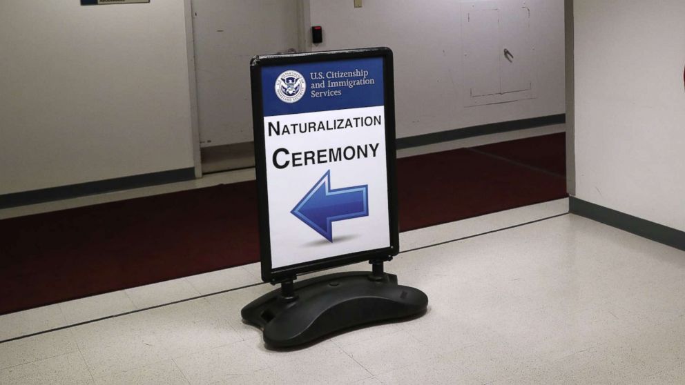 PHOTO: Signage beacons immigrants and their families to a naturalization ceremony on Feb. 2, 2018 in New York.
