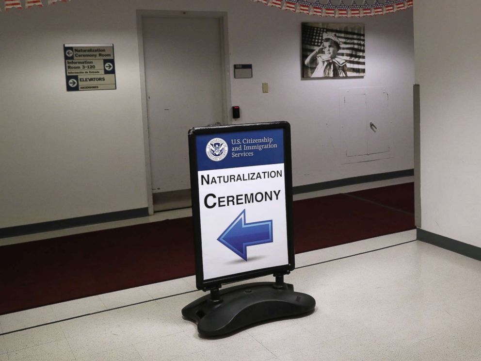 PHOTO: Signage beacons immigrants and their families to a naturalization ceremony on Feb. 2, 2018 in New York.