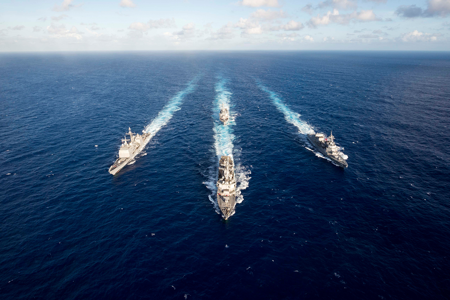 Guided-missile destroyer USS Mustin leads the guided-missile cruiser USS Antietam, USS Curtis Wilbur and the Japan Maritime Self-Defense Force ship JS Fuyuzuki in a formation for the completion of MultiSail 2018 on March 14, 2018, in the Philippine Sea. 