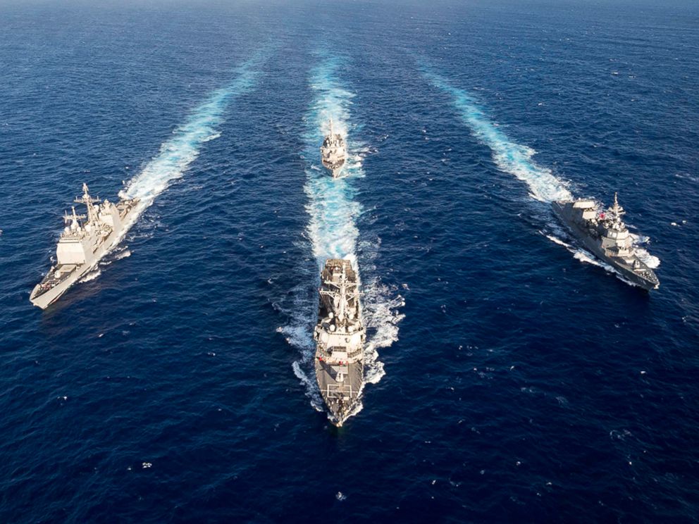 Guided-missile destroyer USS Mustin leads the guided-missile cruiser USS Antietam, USS Curtis Wilbur and the Japan Maritime Self-Defense Force ship JS Fuyuzuki in a formation for the completion of MultiSail 2018 on March 14, 2018, in the Philippine Sea.
