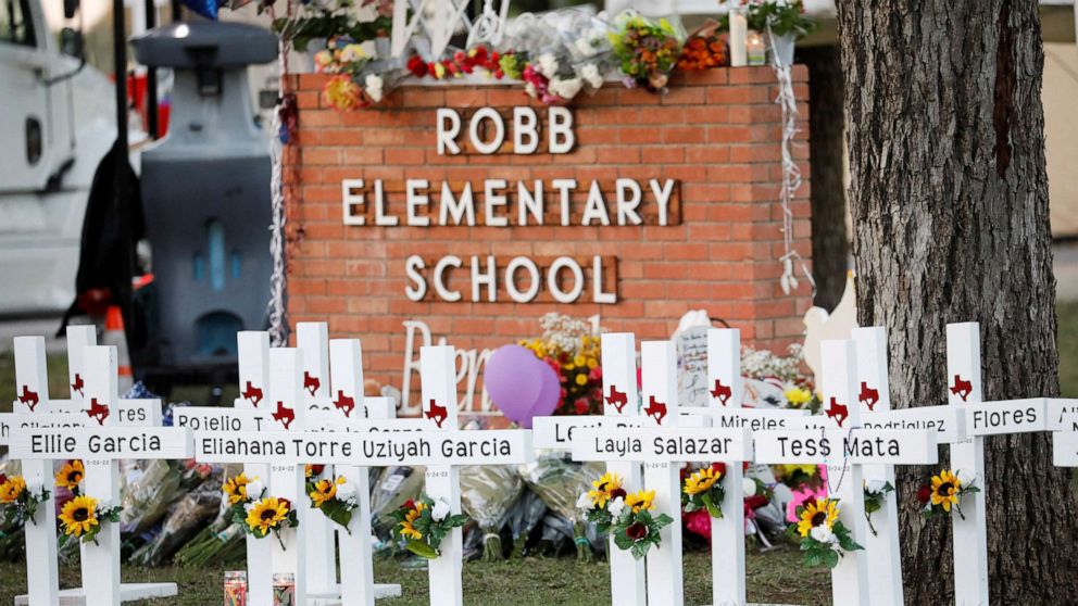 PHOTO: Crosses with the names of victims of a school shooting, are pictured at a memorial outside Robb Elementary school, after a gunman killed nineteen children and two teachers, in Uvalde, US May 26, 2022. 