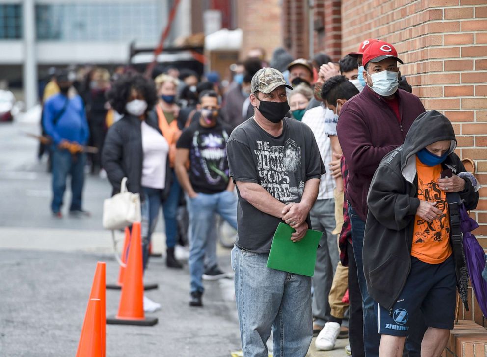 PHOTO: People stand in line to receive COVID-19 vaccines in Reading. Pa., April 21, 2021.