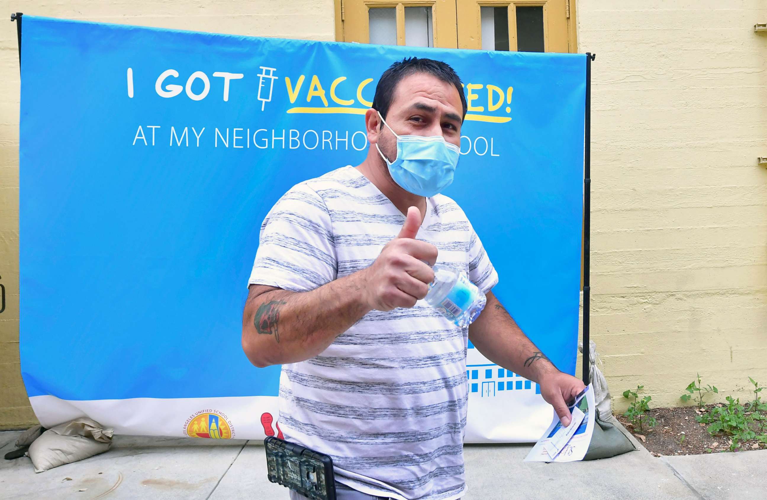 PHOTO: A man gives a thumbs after receiving his first Pfizer Covid-19 vaccine  at Abraham Lincoln High School in Los Angeles, April 23, 2021. 