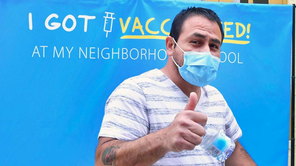 PHOTO: A man gives a thumbs after receiving his first Pfizer Covid-19 vaccine  at Abraham Lincoln High School in Los Angeles, April 23, 2021. 