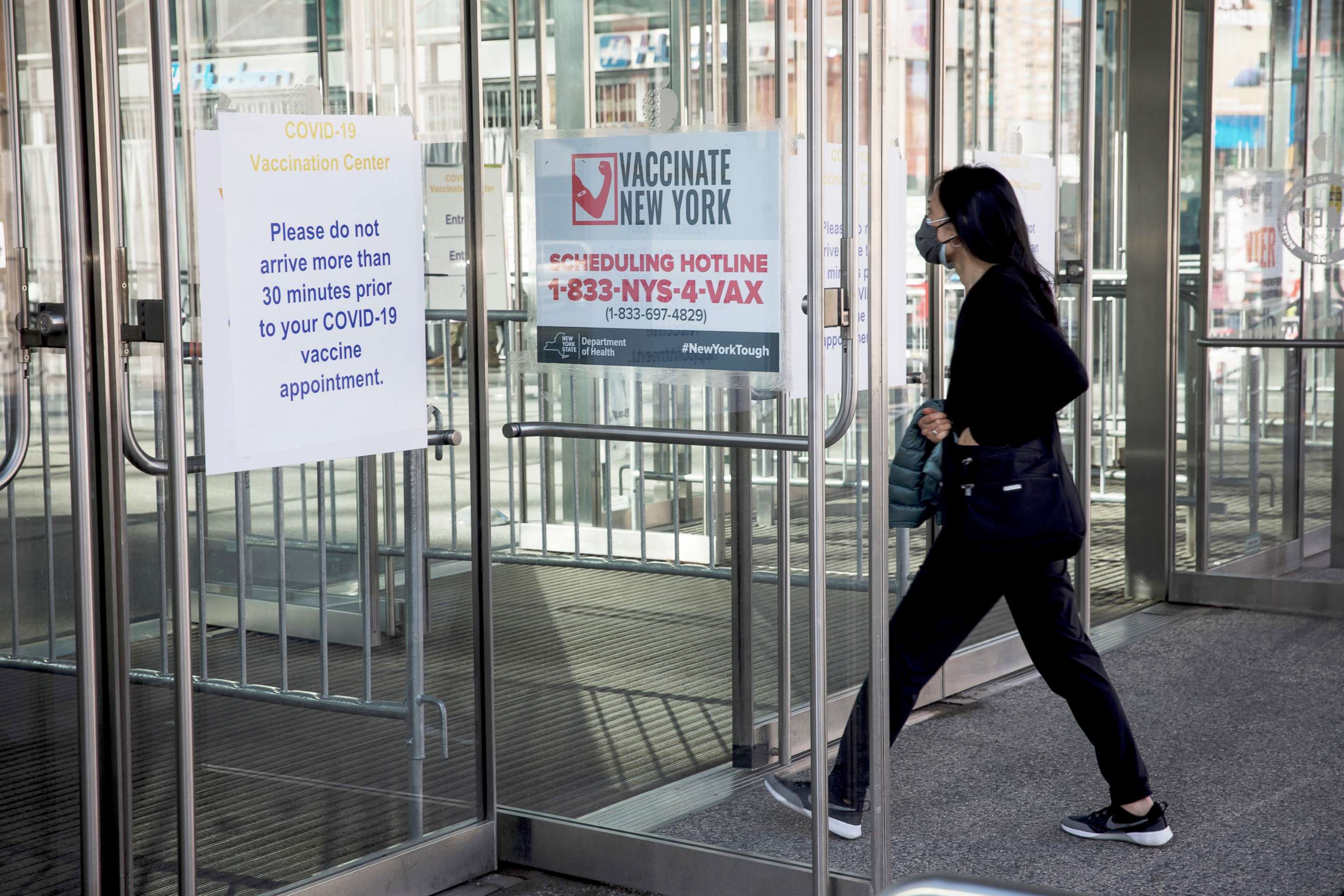 PHOTO: Signage directs visitors to the vaccination site at the Javits Center in New York, April 6, 2021.