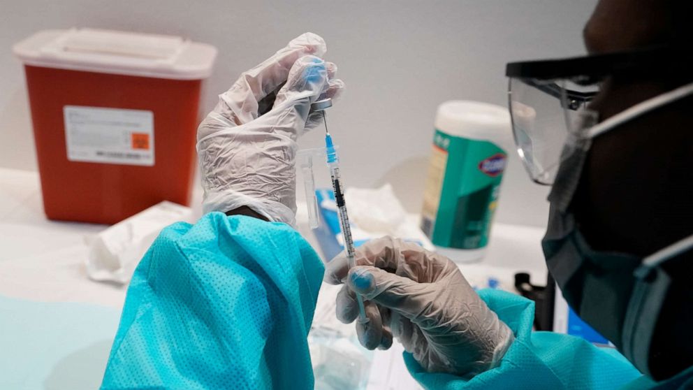 PHOTO: A health care worker fills a syringe with the Pfizer COVID-19 vaccine in New York, July 22, 2021.