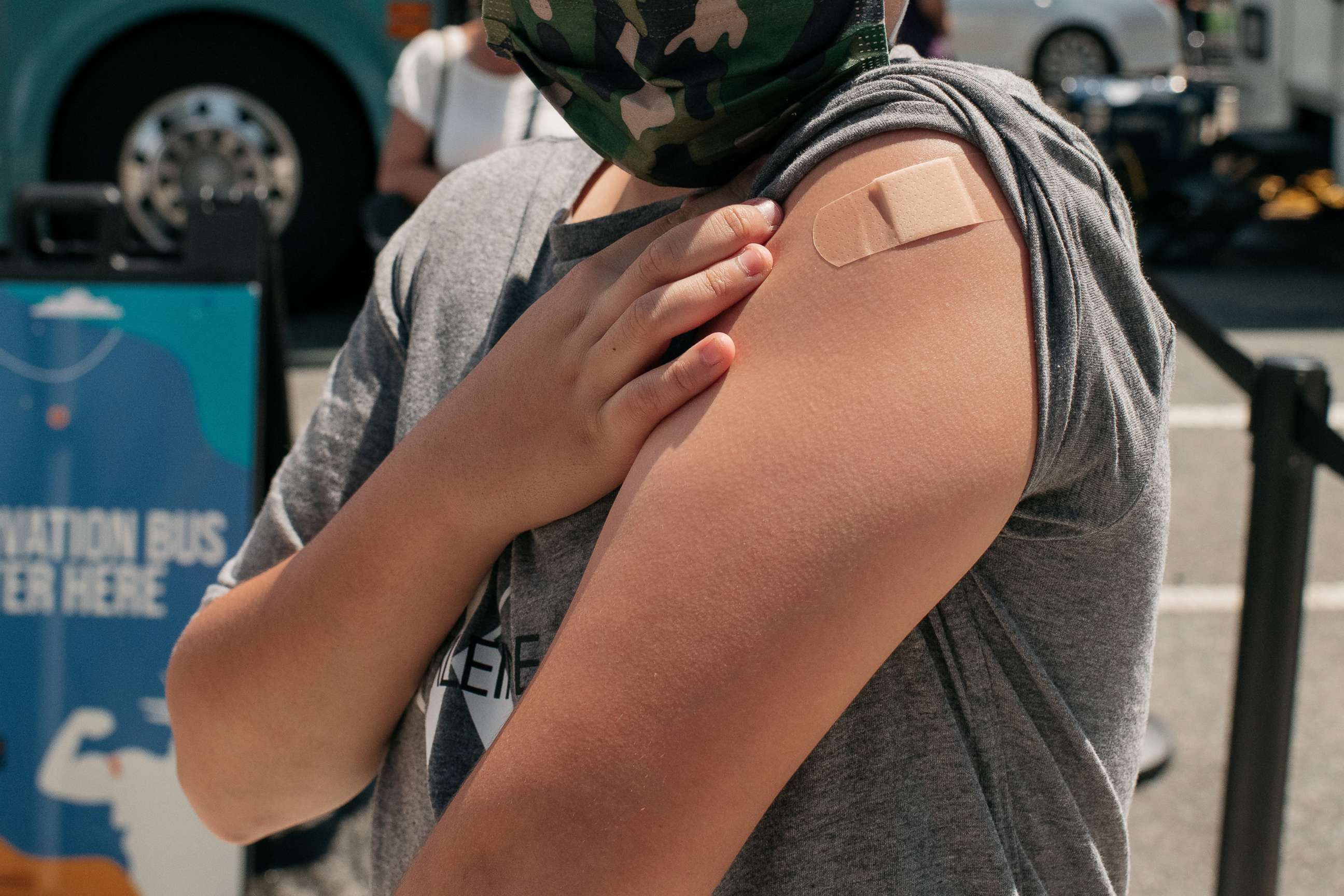PHOTO: A 13-year-old newly vaccinated against COVID-19 shows his bandage at a pop-up vaccination site, June 5, 2021, in the Jackson Heights neighborhood in the Queens borough in New York.