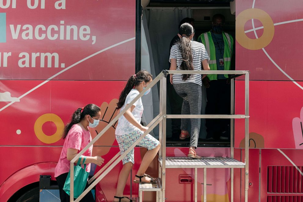 PHOTO: A family enters a pop-up COVID-19 vaccine site, June 5, 2021, in the Jackson Heights neighborhood in the Queens borough in New York.