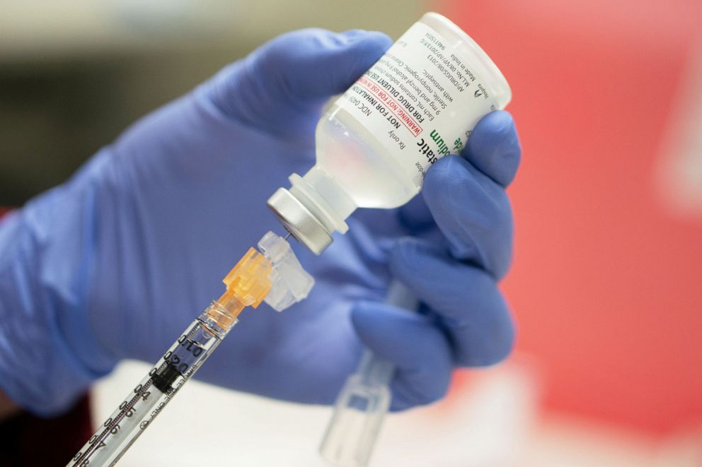 PHOTO: A mock vial of the Pfizer vaccine for COVID-19 is used during a staff vaccine training session in Madison, Wisc., Dec. 8, 2020.