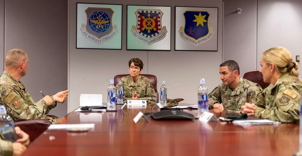 PHOTO: Gen. Jacqueline Van Ovost, Air Mobility Command commander, listens to Col. Doug Jackson, 621st Contingency Response Wing commander, about the wing mission, Aug. 31, 2020, on Travis Air Force Base, Calif.