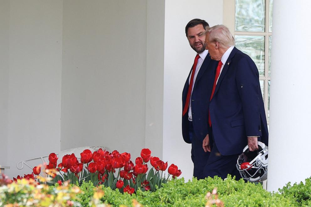 PHOTO: U.S. President Donald Trump and Vice President JD Vance walk, after meeting with the Ohio State University 2025 College Football National Champions, at the White House, in Washington, D.C., April 14, 2025.