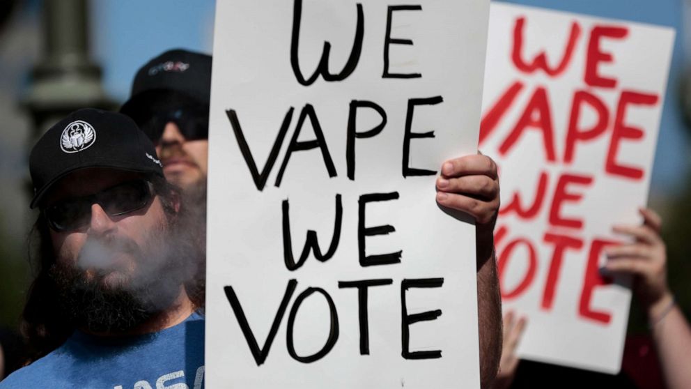 PHOTO: Mark Asbrock, of Fairfield, Ohio, vapes while listening to speakers during a vaping advocates rally, Oct. 1, 2019, at the Ohio Statehouse in Columbus, Ohio. 