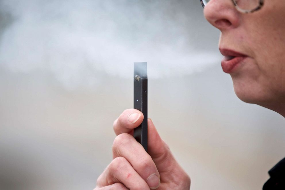 PHOTO: A woman exhales a puff of vapor from a Juul pen in Vancouver, Wash.