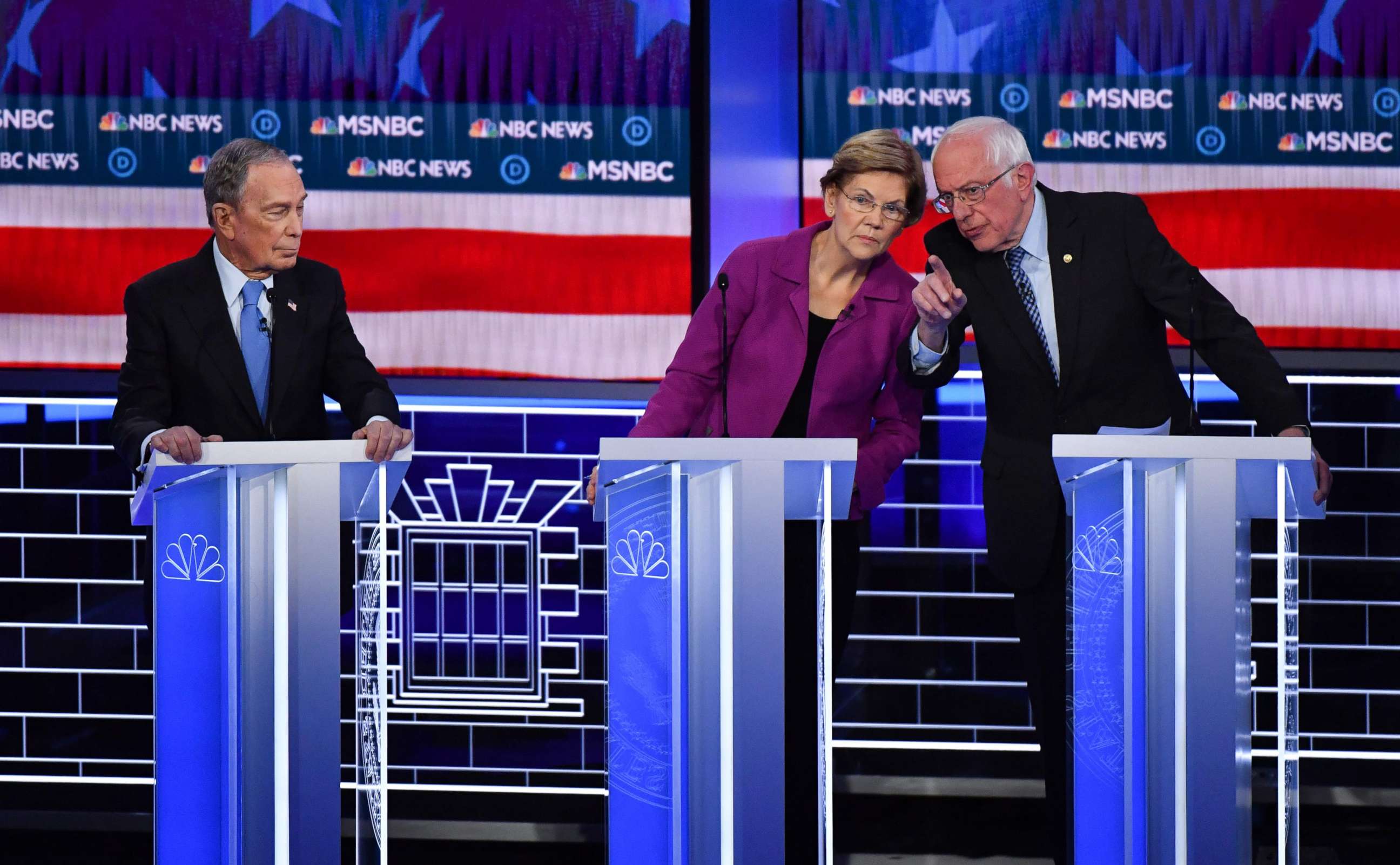 PHOTO: Democratic presidential hopefuls Mike Bloomberg, Sen. Elizabeth Warren and Sen. Bernie Sanders talk during the ninth Democratic primary debate at the Paris Theater in Las Vegas, Feb. 19, 2020.
