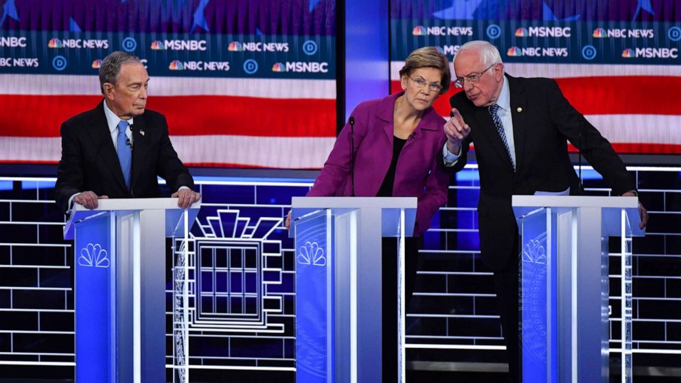 PHOTO: Democratic presidential hopefuls Mike Bloomberg, Sen. Elizabeth Warren and Sen. Bernie Sanders talk during the ninth Democratic primary debate at the Paris Theater in Las Vegas, Feb. 19, 2020.