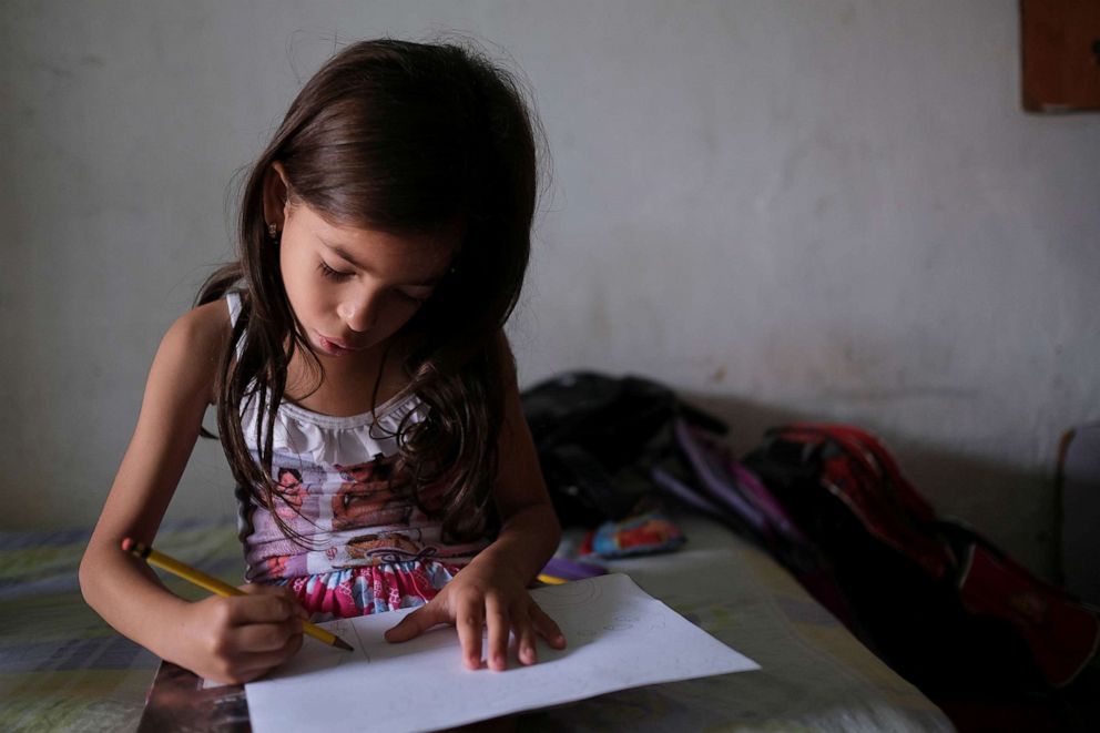 PHOTO: Deina Alvarez, 6, who is underweight for her age according to her mother Diana Rodriguez, and is undergoing treatment for malnutrition at the non-profit organization Mapani, draws a picture at her house in Barquisimeto, Venezuela, Nov. 27, 2019.