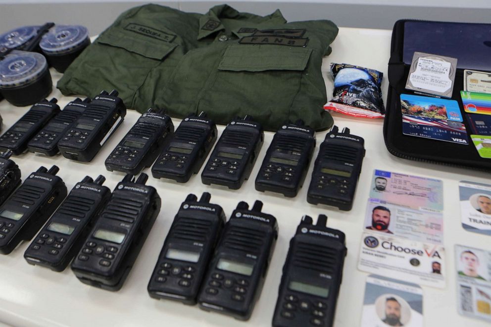 PHOTO: ID cards and equipment of people linked to an operation denounced by Venezuelan President Nicolas Maduro, during a meeting with members of the Armed Forces in Caracas, Venezuela, May 4, 2020.