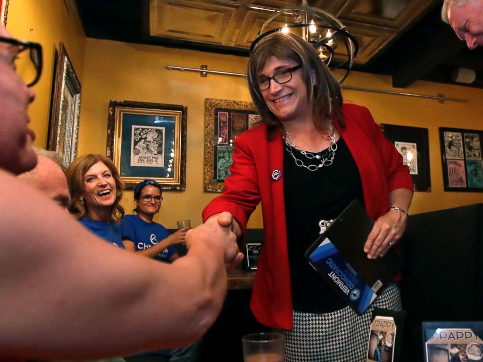 PHOTO: Vermont Democratic gubernatorial candidate Christine Hallquist, holding clipboard, a transgender woman and former electric company executive, shakes hands with her supporters during her election night party in Burlington, Vt., on Aug. 14, 2018.