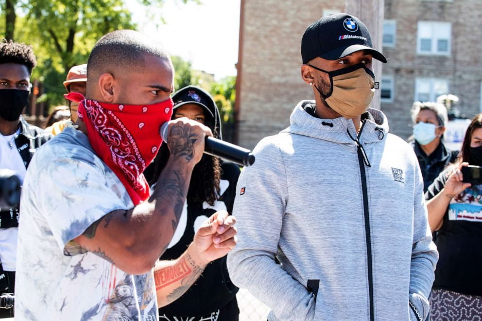 PHOTO: Vic Mensa and Joey Purp attend the Year Of The Youth Peace Walk & Give Back Event at Overton Elementary School, Sept. 19, 2020, in Chicago.