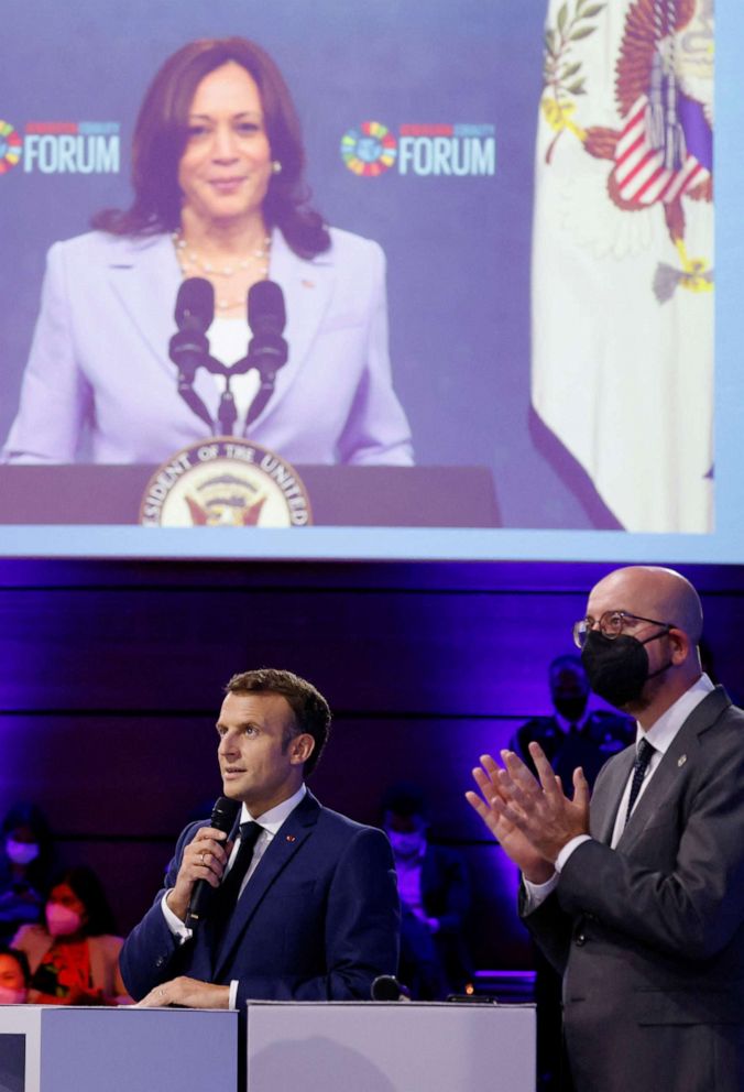PHOTO: French President Emmanuel Macron listens to US Vice President Kamala Harris (on screen) during the Generation Equality Forum, a global gathering for gender equality convened by UN Women in Mexico City, July 2, 2021.