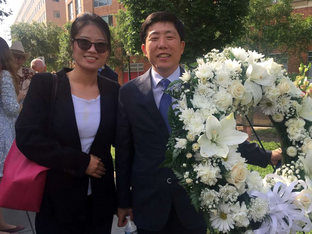 PHOTO: Grace Jo and Sang Hak Park wait in line for a wreath laying ceremony for victims of communism in Washington, June 8, 2018.