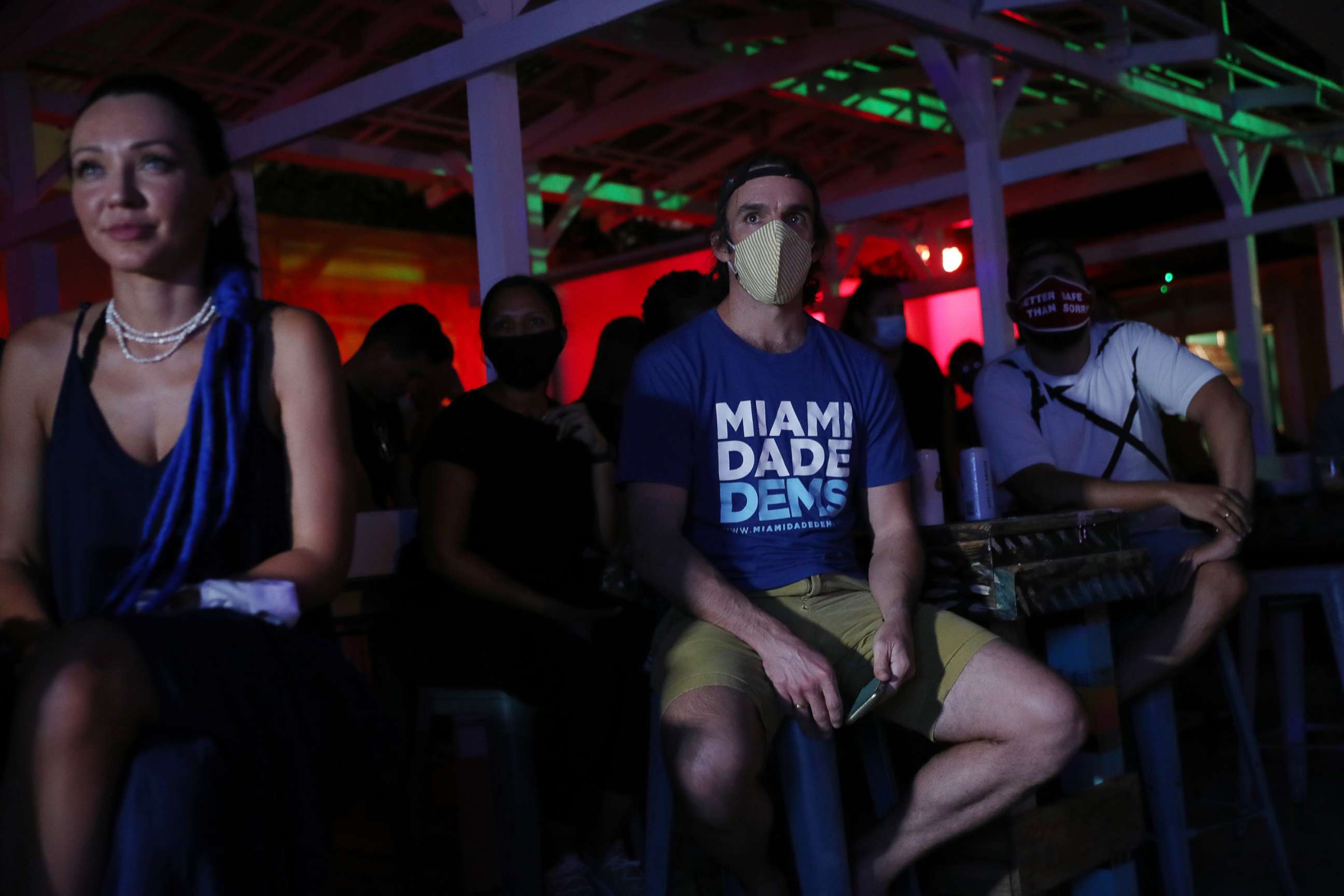 PHOTO: Dan Royles and other people watch at Gramps bar a streaming broadcast of the first debate between President Donald Trump and Democratic presidential nominee Joe Biden, Sept. 29, 2020, in Miami.