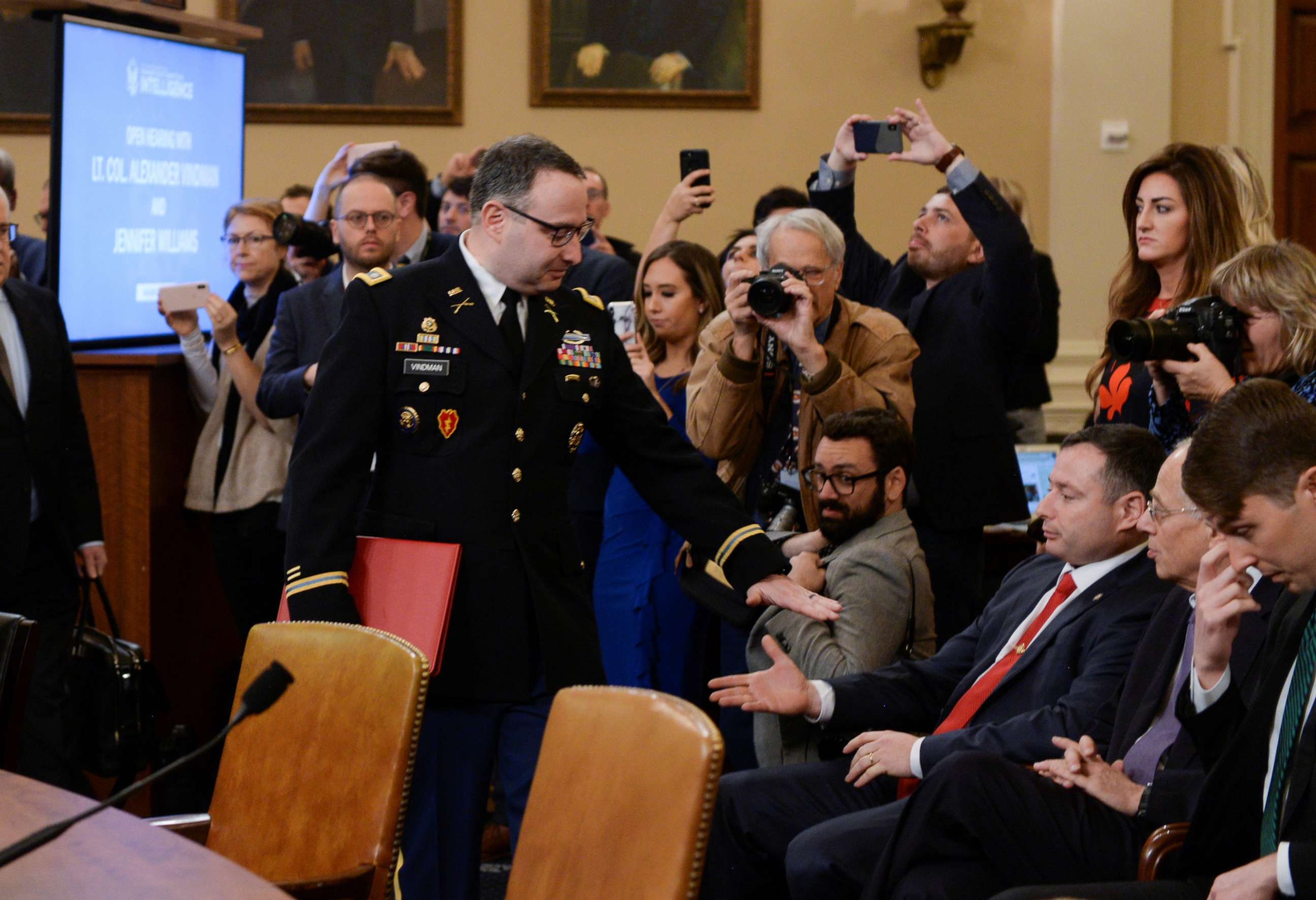 PHOTO: Lt. Colonel Alexander Vindman greets his twin brother Yevgeny Vindman sitting in the audience as Vindman arrives to give testimony as part of the impeachment inquiry into President Donald Trump on Capitol Hill in Washington, D.C., Nov. 19, 2019.