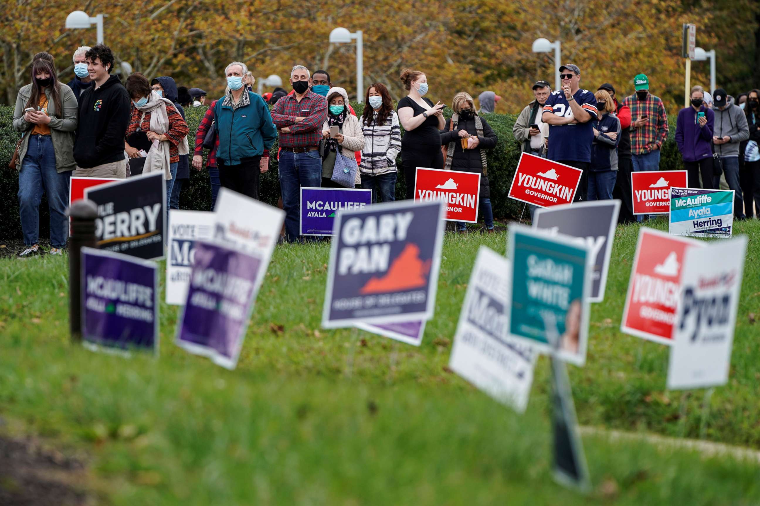 PHOTO: People wait in line on the last day of early voting in the Virginia gubernatorial election in Fairfax, Va., Oct. 30, 2021.