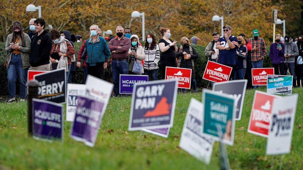 PHOTO: People wait in line on the last day of early voting in the Virginia gubernatorial election in Fairfax, Va., Oct. 30, 2021.