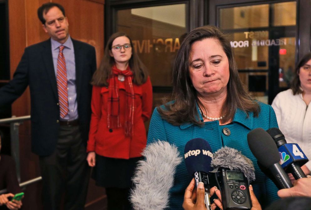PHOTO: Democratic candidate Shelly Simonds, speaks to the press as her husband, Paul Danehy, left, and daughter, Georgia Danehy, listen after a drawing to determine the winner of a tied election at the Capitol in Richmond, Va., Jan. 4, 2018. 