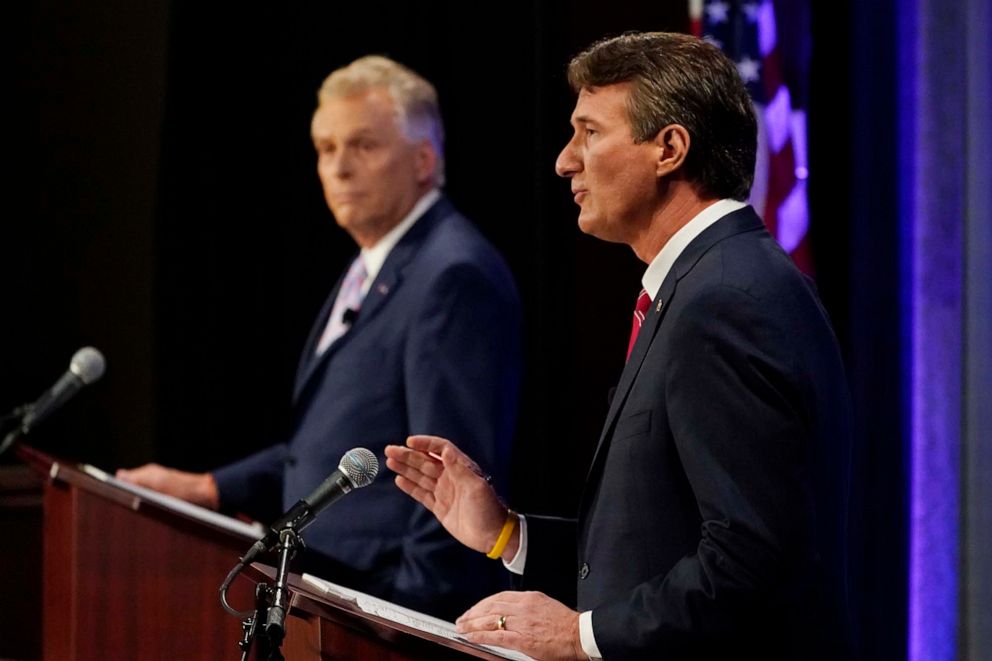 PHOTO: Republican gubernatorial candidate Glenn Youngkin, right, gestures as Democratic gubernatorial candidate former Governor Terry McAuliffe, left, listens during a debate at the Appalachian School of Law in Grundy, Va., Sept. 16, 2021