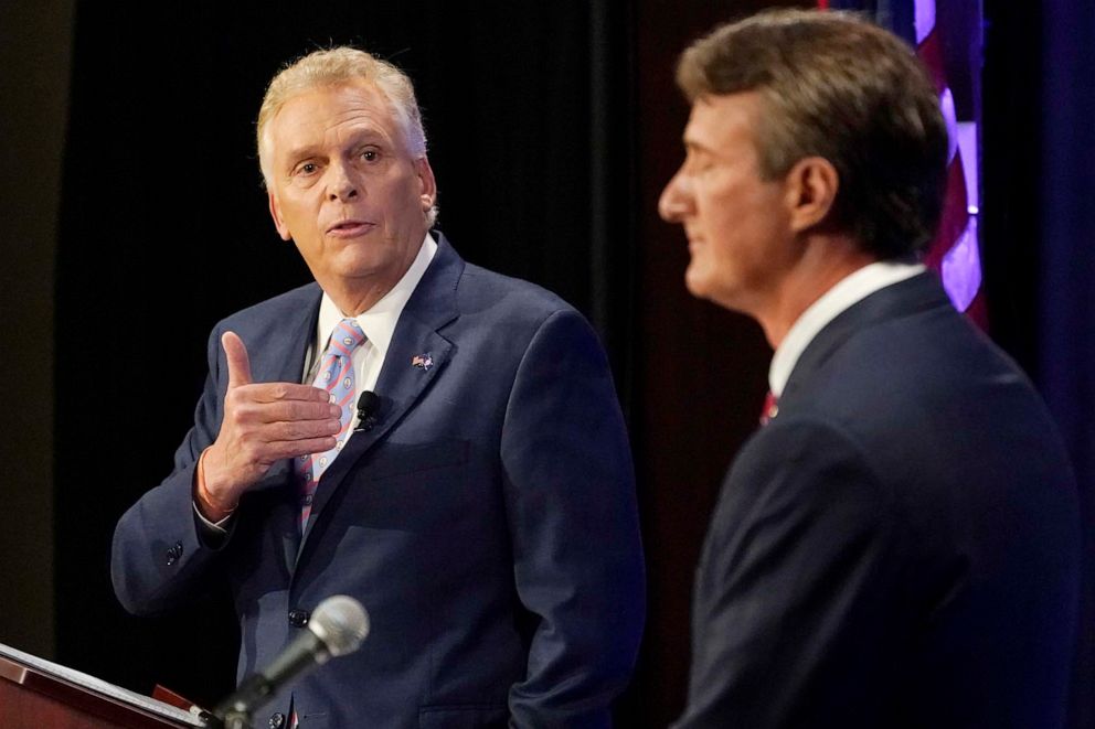 PHOTO: Democratic gubernatorial candidate former Governor Terry McAuliffe, left, gestures as Republican challenger, Glenn Youngkin, listens during a debate at the Appalachian School of Law in Grundy, Va., Sept. 16, 2021.