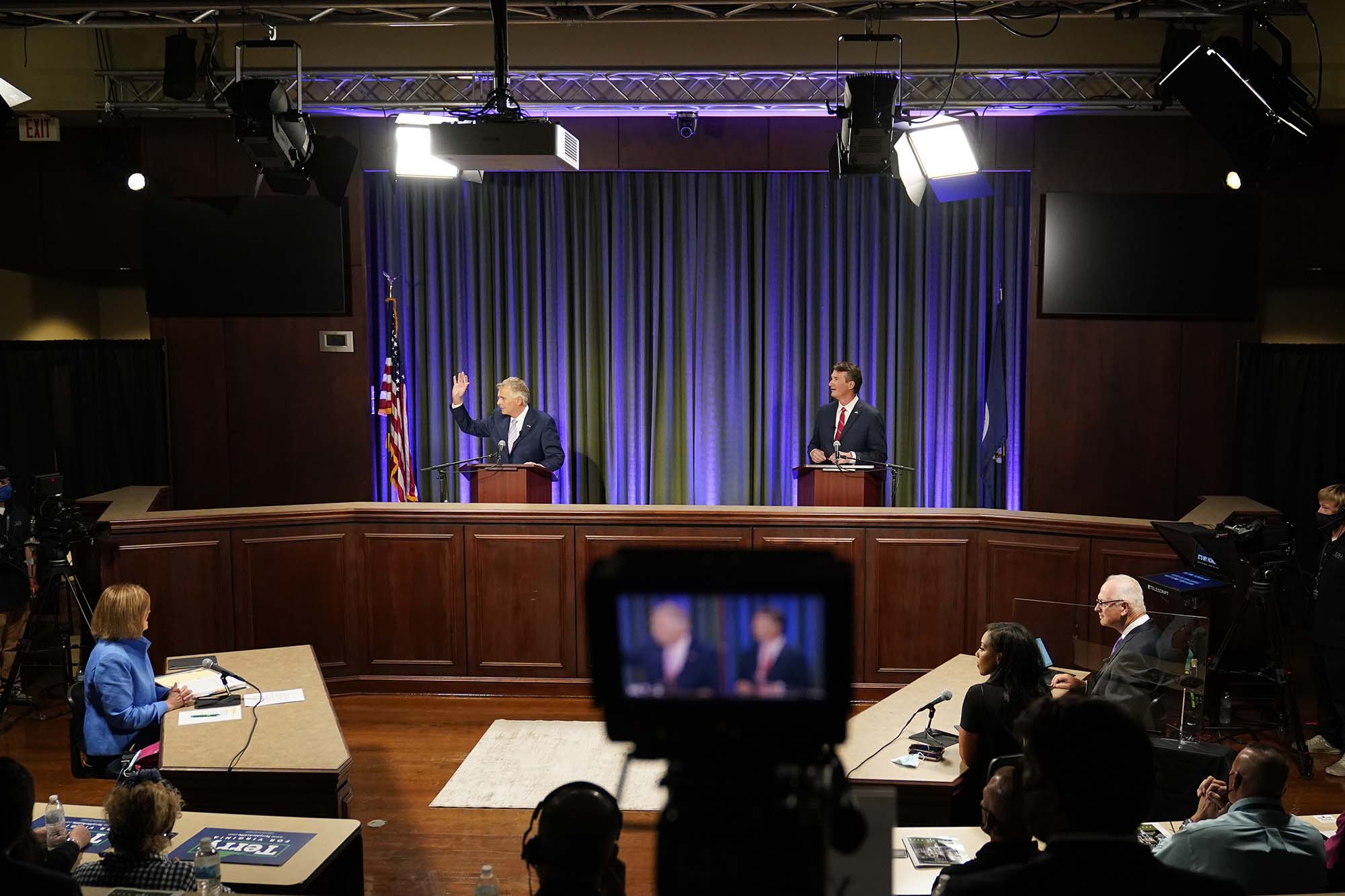 PHOTO: Democratic gubernatorial candidate former Governor Terry McAuliffe, left, and Republican challenger, Glenn Youngkin, prepare for a debate at the Appalachian School of Law in Grundy, Va., Sept. 16, 2021. 