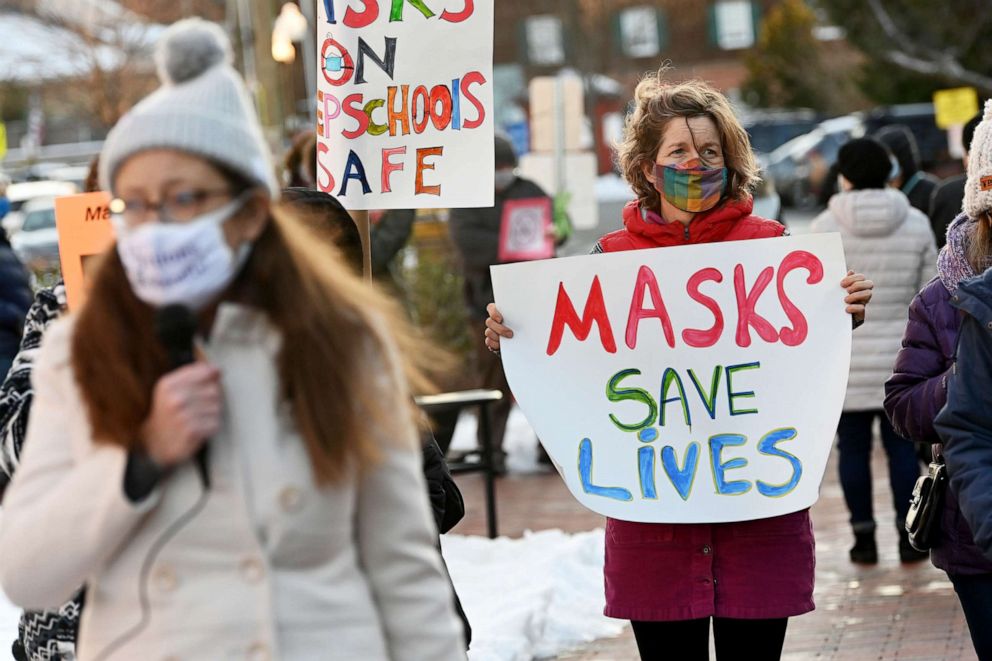 PHOTO: People gather in support of continuing the school mask mandate outside the Loudon County Government Center prior to a Board of Supervisors meeting on Tuesday January 18, 2022 in Leesburg, Va., Jan. 18, 2022. 