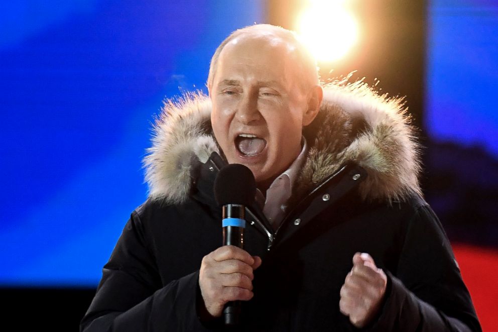 PHOTO: President Vladimir Putin addresses the crowd during a rally and a concert celebrating the fourth anniversary of Russia's annexation of Crimea at Manezhnaya Square in Moscow, March 18, 2018. 