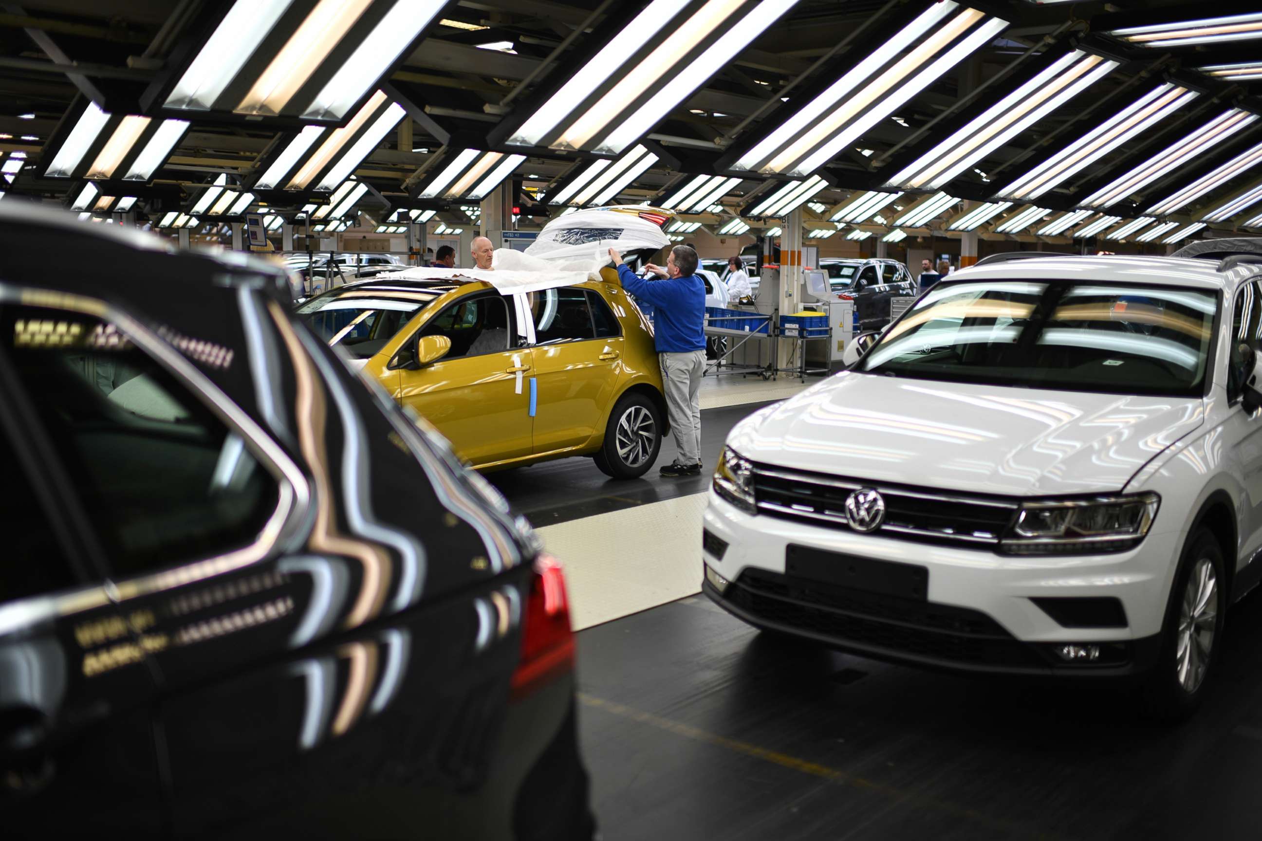 PHOTO: Workers assemble Volkswagen Golf cars at the Volkswagen factory on March 8, 2018 in Wolfsburg, Germany.