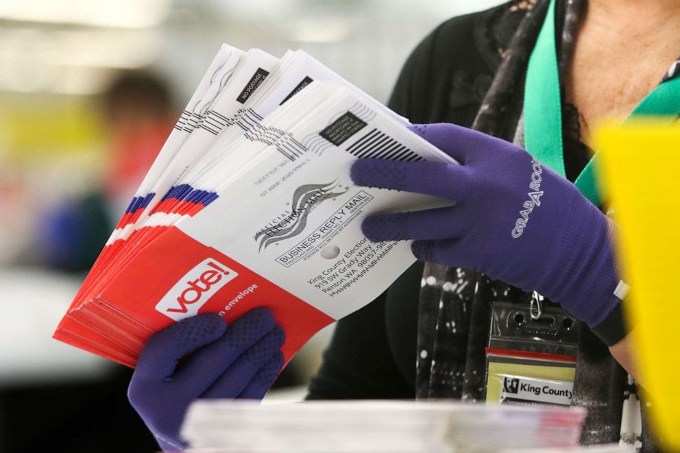 PHOTO: An election workers sorts vote-by-mail ballots for the presidential primary at King County Elections in Renton, Washington on March 10, 2020.