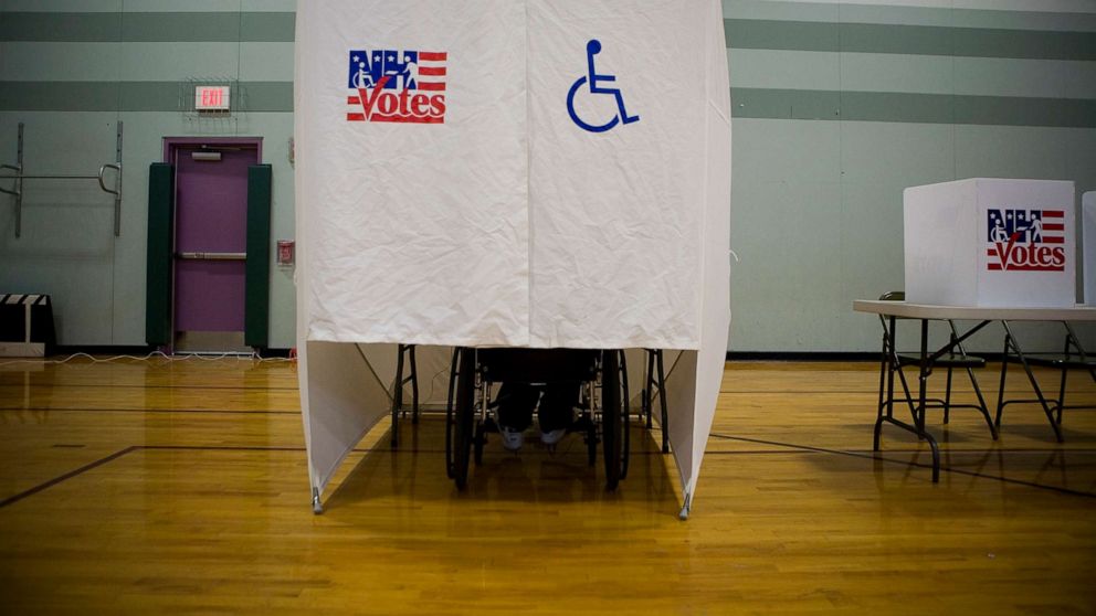 PHOTO: A disabled person uses a specially designed booth for voting during the New Hampshire primary at a high school in Nashua, N.H., Jan. 8, 2008.