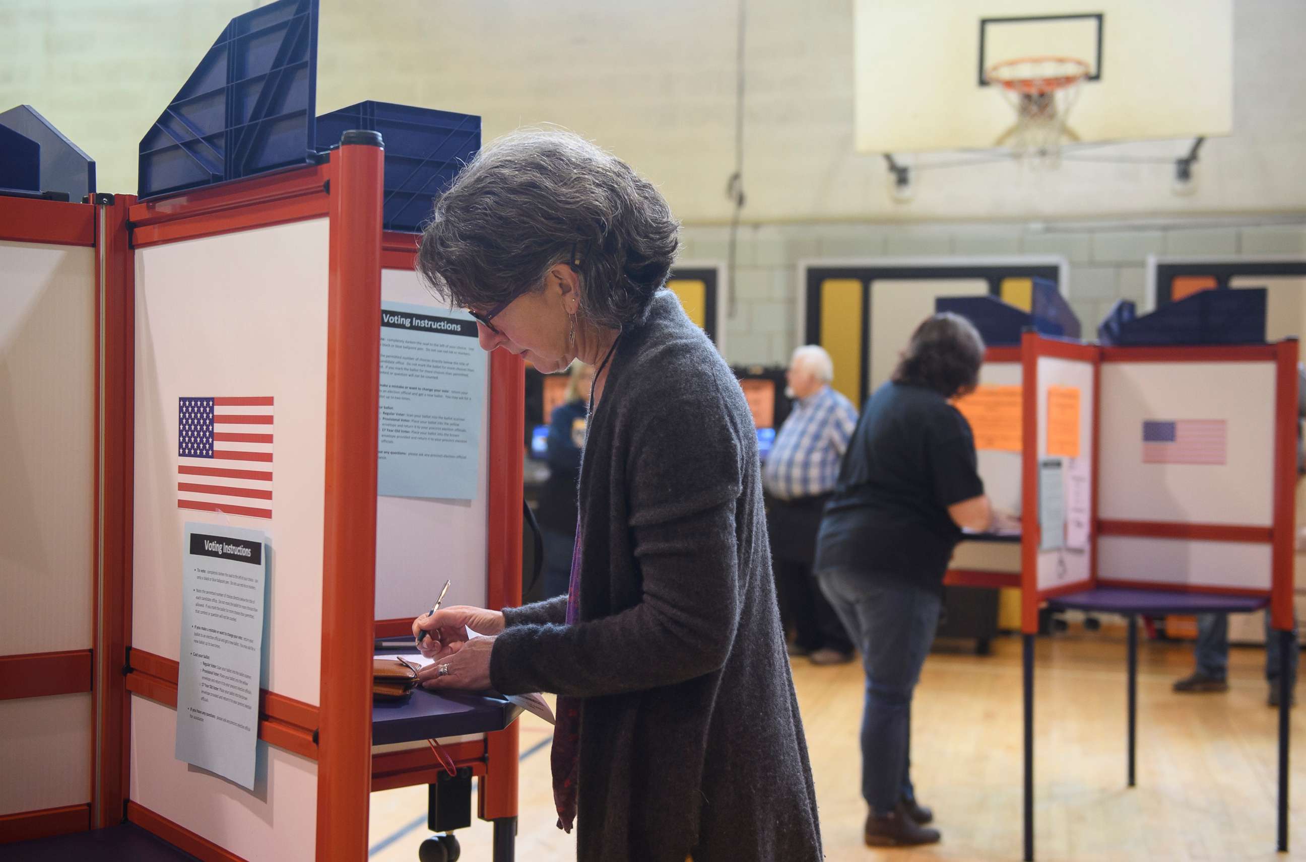 PHOTO: In this May 3, 2022, file photo, a voter fills in her ballot during primary voting at Central Elementary School in Kent, Ohio.