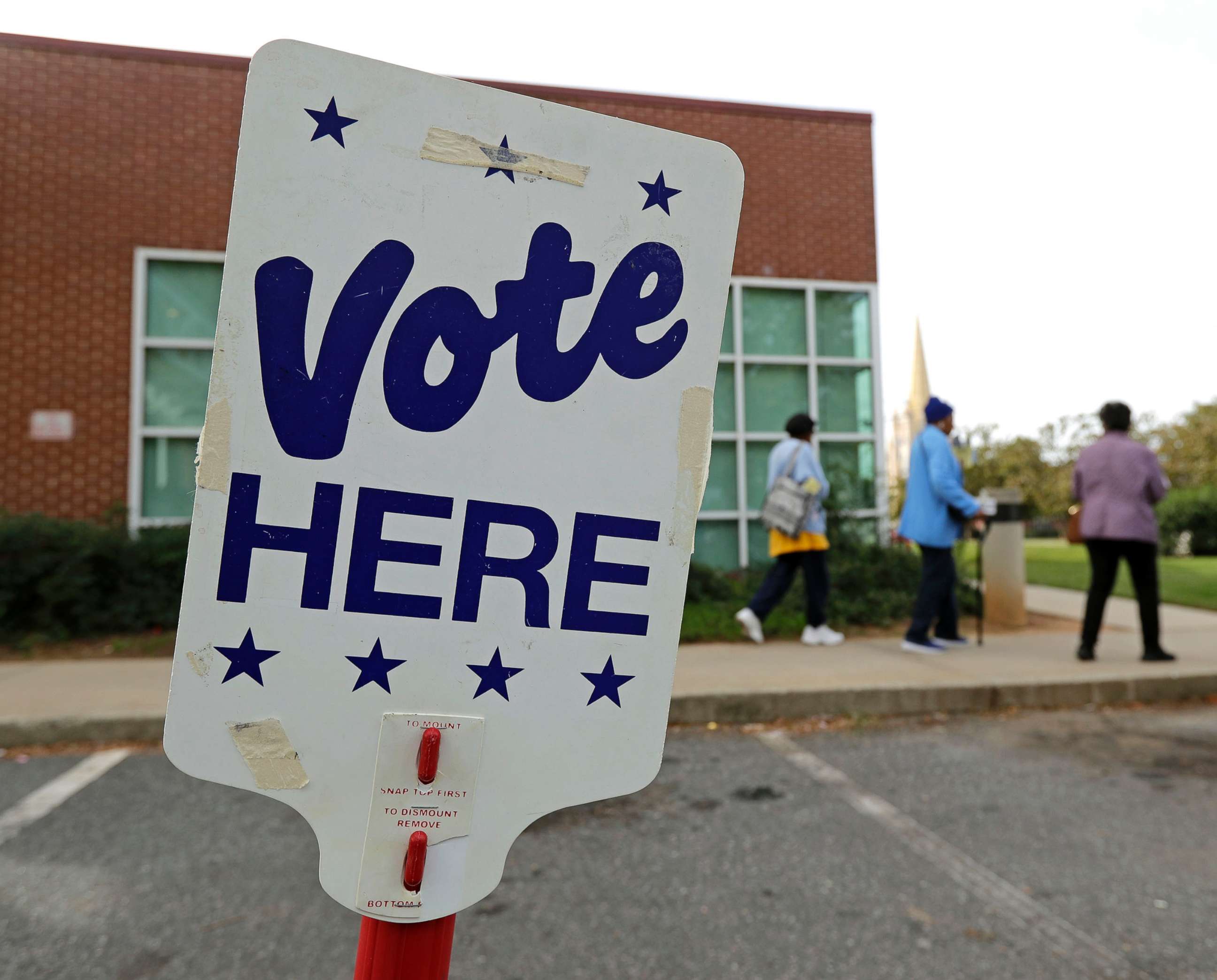 PHOTO: People arrive for early voting at a polling place in Charlotte, N.C., Oct. 23, 2018.