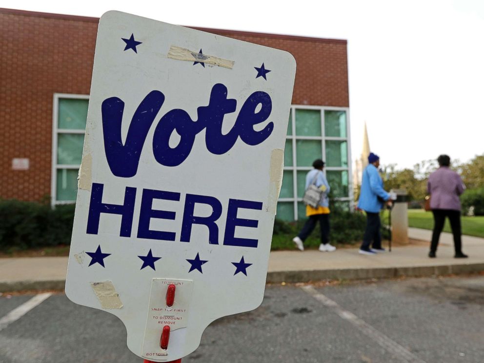 PHOTO: People arrive for early voting at a polling station in Charlotte, NC on October 23, 2018.