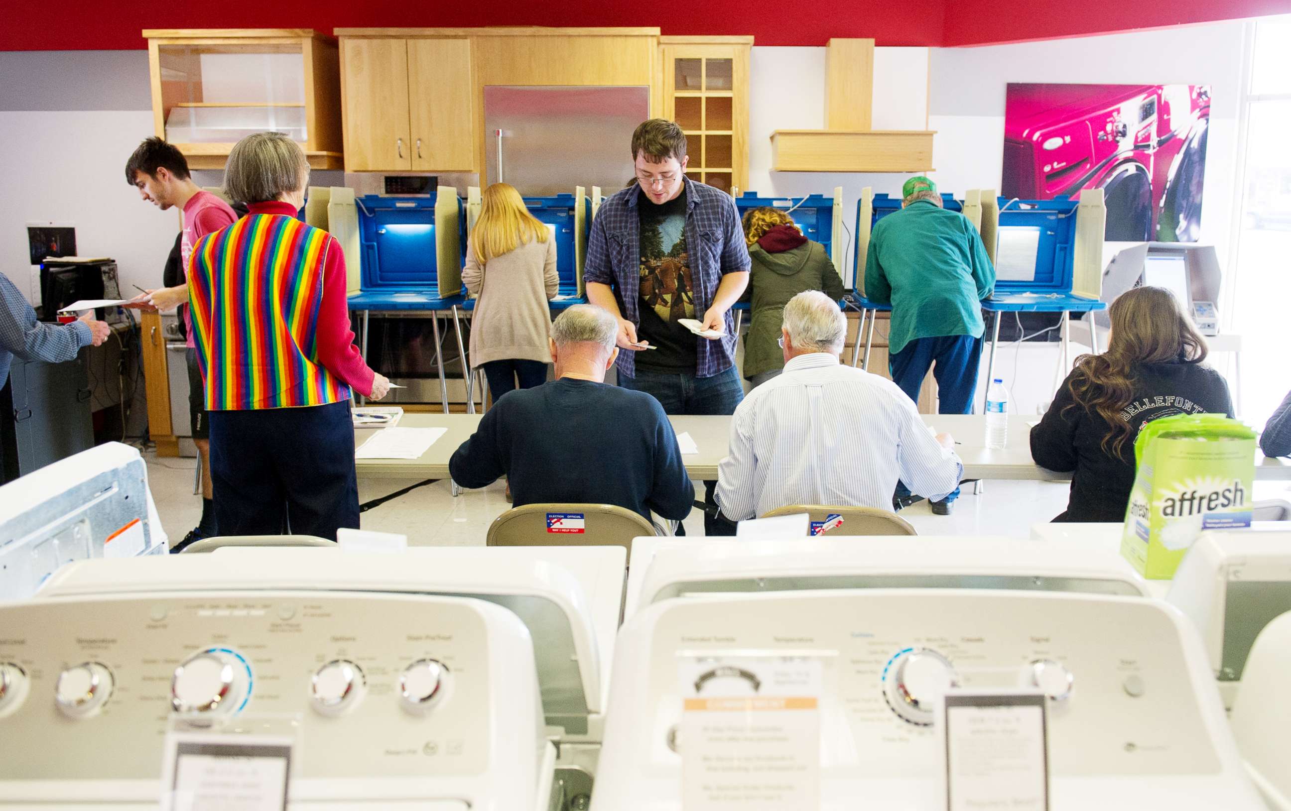 PHOTO: Voters cast their ballots in a polling location inside Mike's TV and Appliance on Nov. 8, 2016, in State College, Pa. 