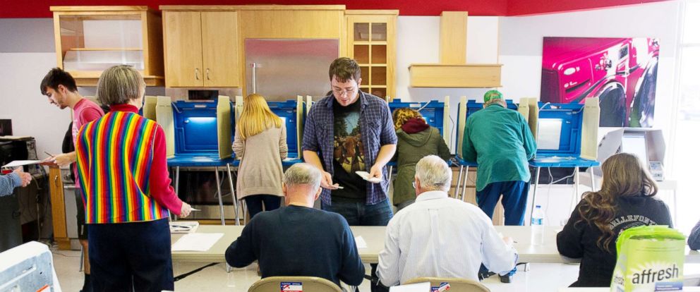 PHOTO: Voters cast their ballots in a polling location inside Mikes TV and Appliance on Nov. 8, 2016, in State College, Pa. 