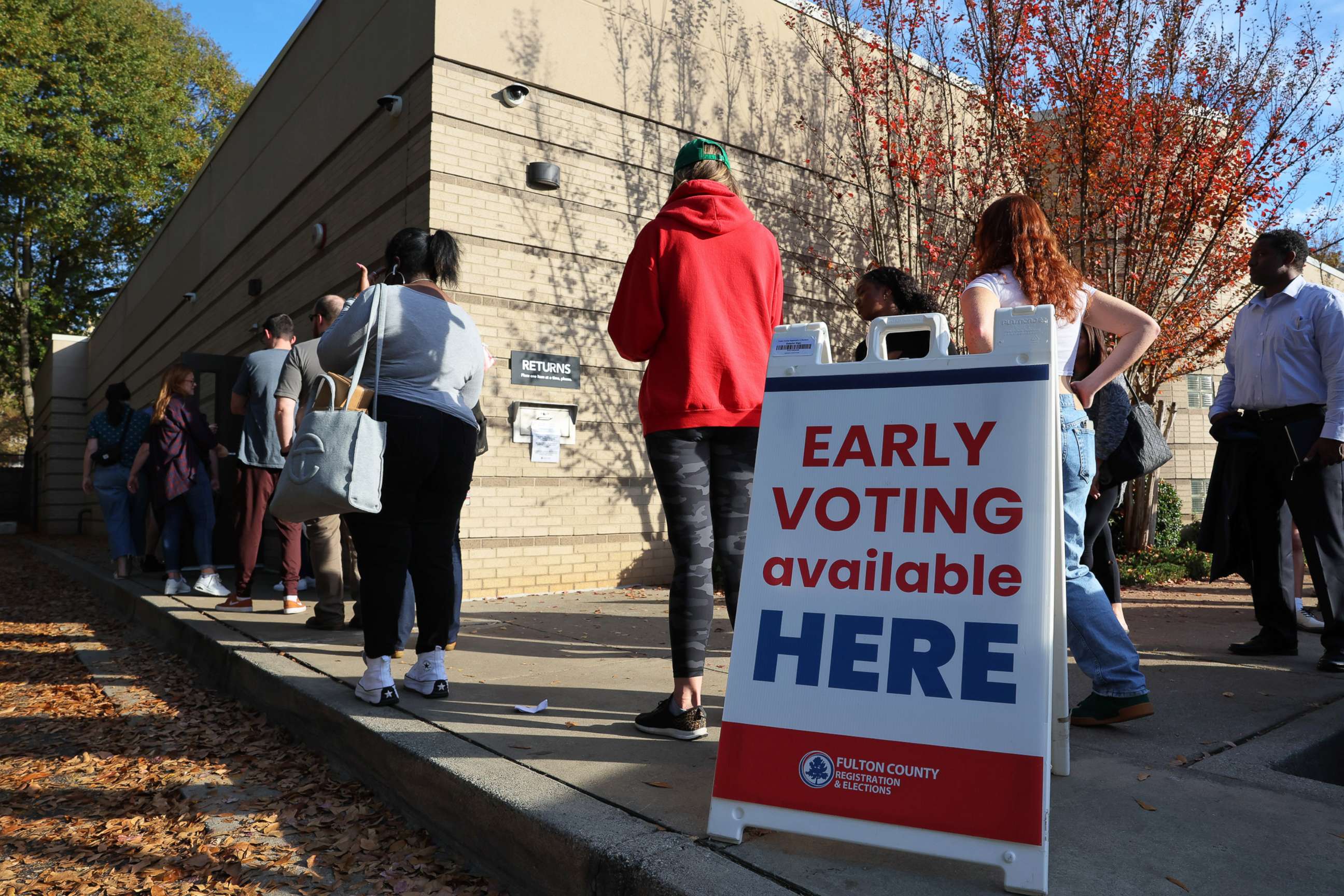 PHOTO: People wait in line for early voting for the midterm elections at Ponce De Leon Library on Nov. 4, 2022 in Atlanta.