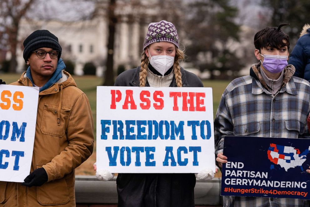 PHOTO: A demonstrator holds a sign reading "Pass the Freedom to Vote Act" during a protest at the Capitol, Jan. 20, 2022. 