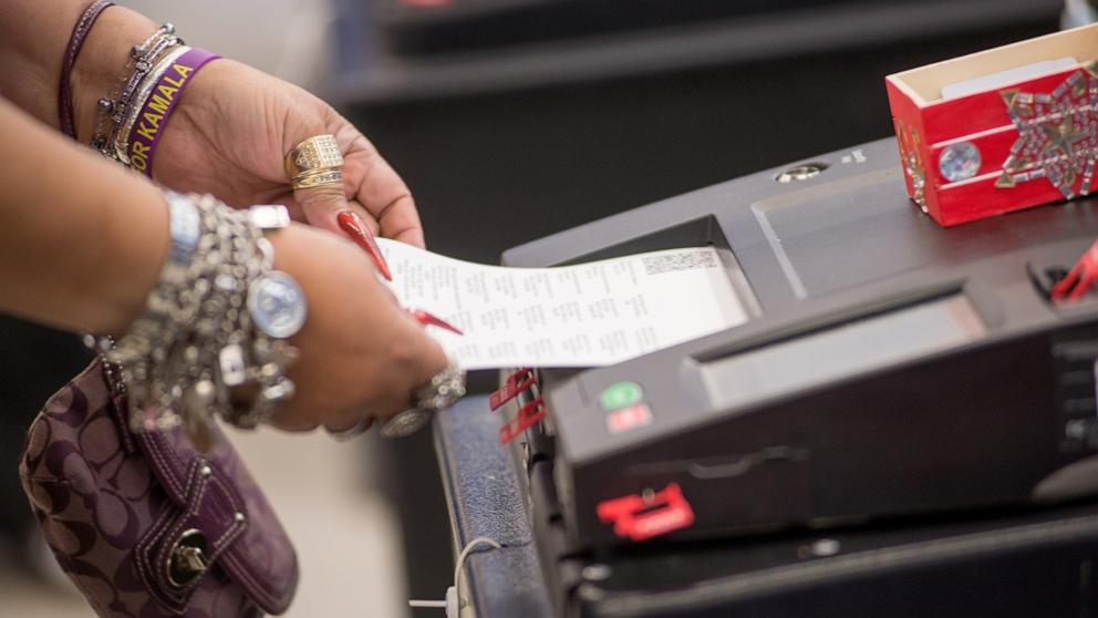 PHOTO: A voter casts their ballot during early voting for the Presidential General Election in Chicago, Illinois on October 3, 2024.